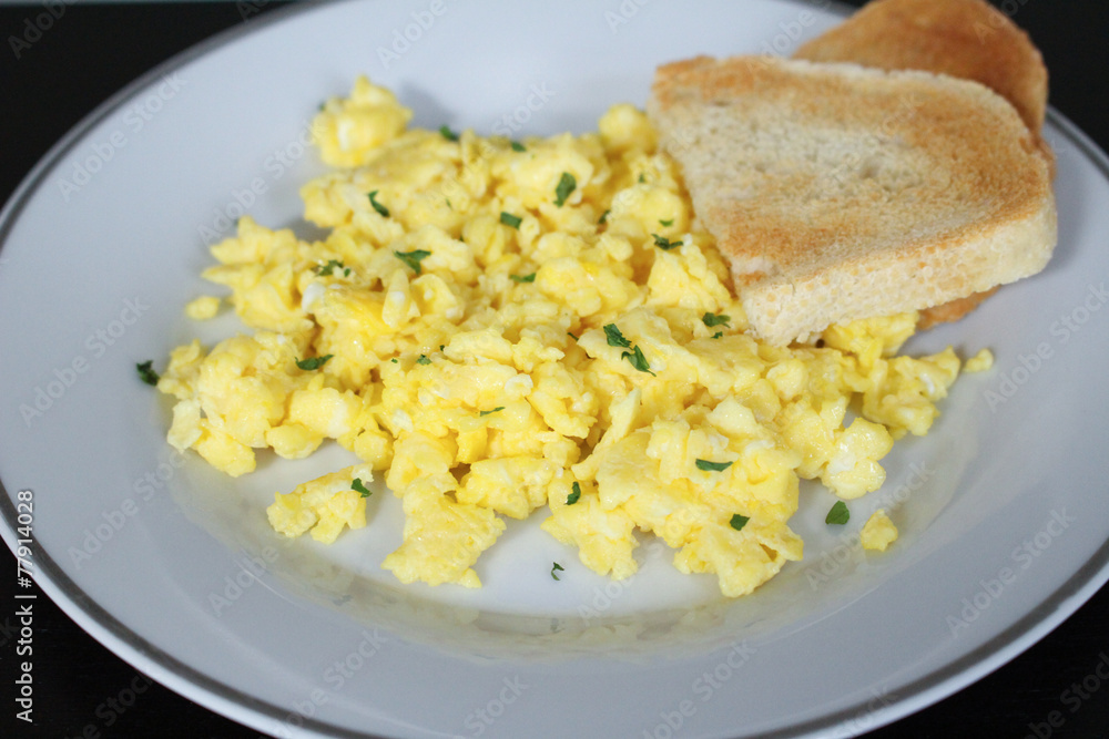 Scrambled eggs with toasted white bread Scrambled eggs with toasted white bread