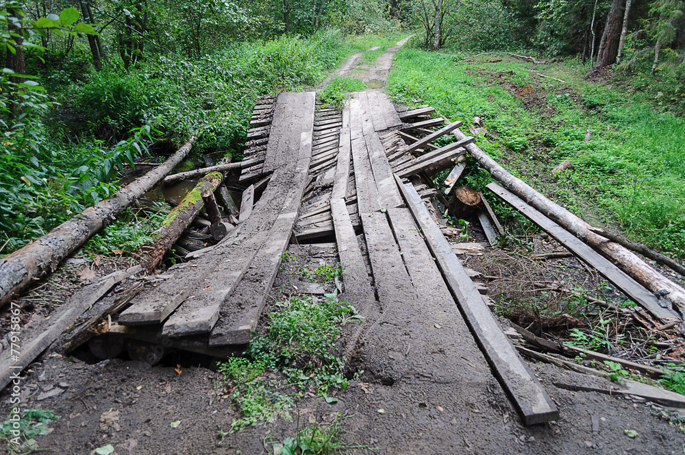Dirty broken wooden bridge in forest Dirty broken wooden bridge in forest