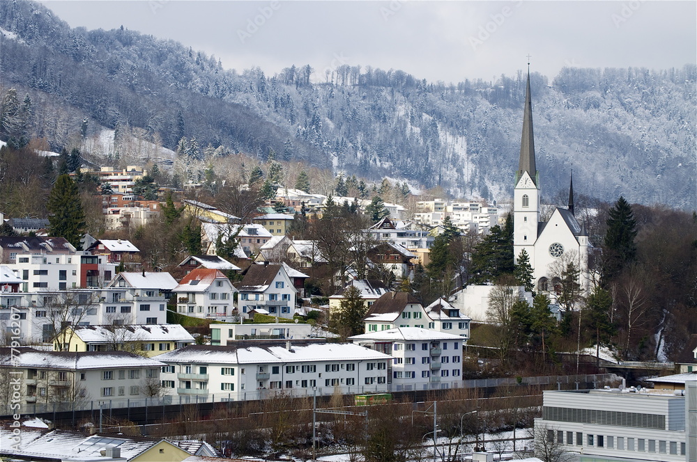 Adliswil im Winter mit Albiskette StockFoto Adobe Stock