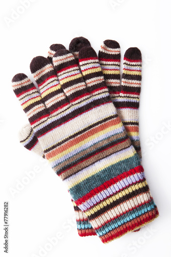 Colourful winter gloves on white background