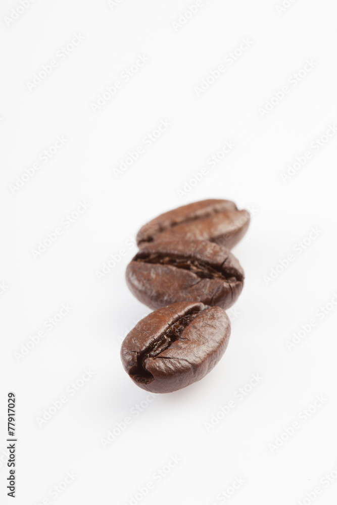 Close up of Three roasted coffee beans Close up of Three roasted coffee beans