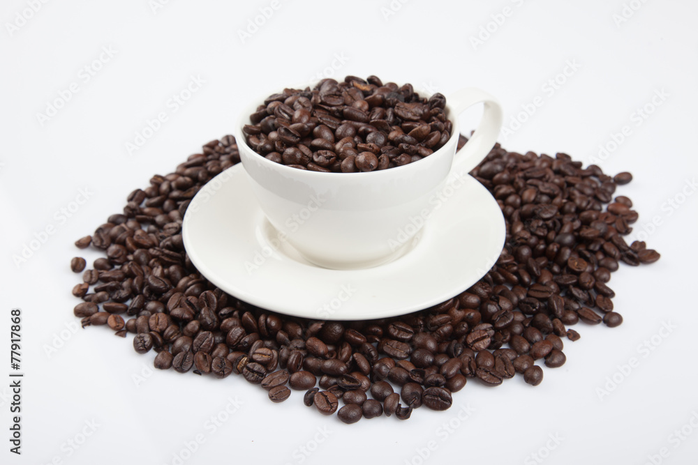 Roasted coffee beans with a cup Roasted coffee beans with a cup