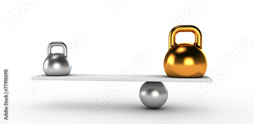 Two gold and silver kettlebells  in equilibrium