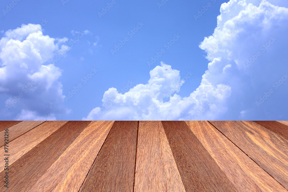 Plank flooring and blue sky.