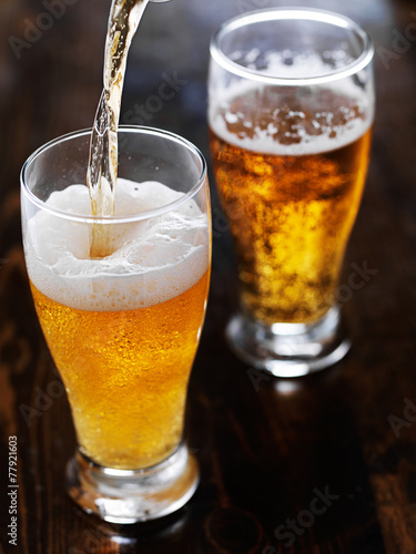 Wallpaper Mural pouring beer into a tall mug on slate table Torontodigital.ca