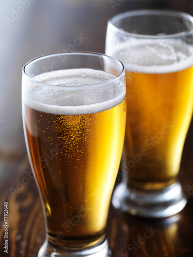 two mugs of beer close up