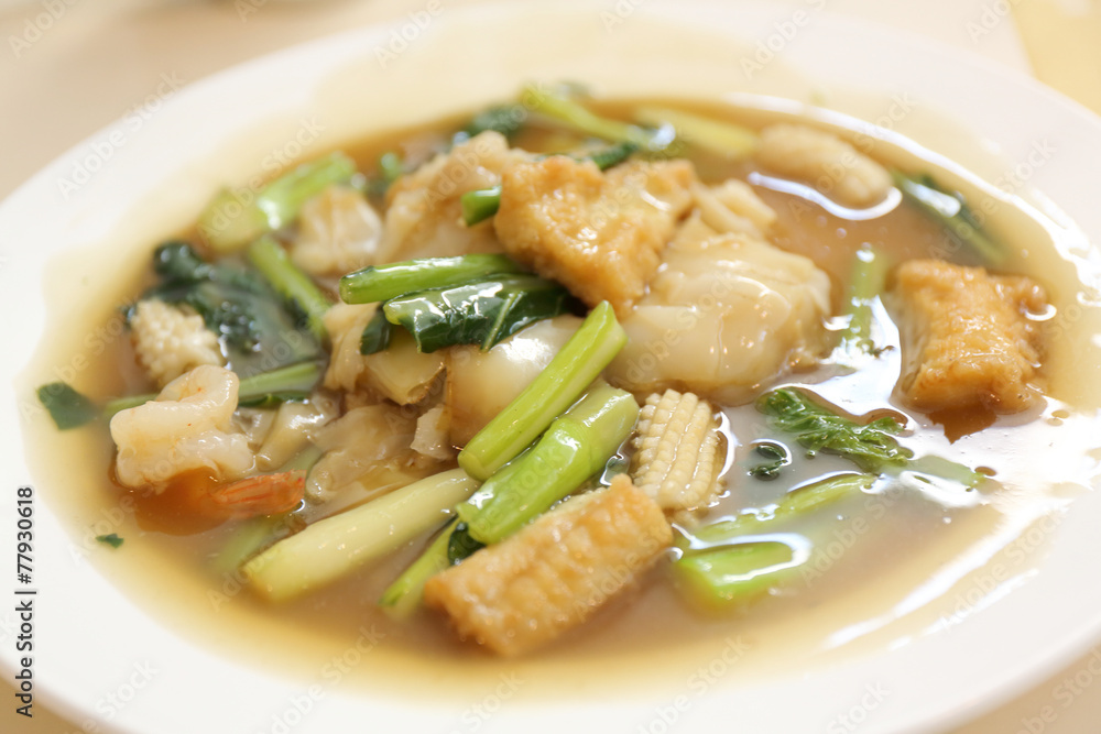Thai food Wide Noodles in a Creamy Sauce with seafood Thai food Wide Noodles in a Creamy Sauce with seafood