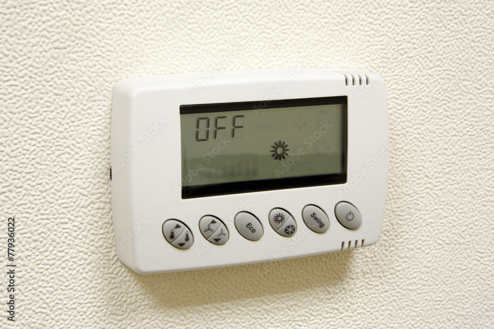 Digital climate thermostat on the wall Digital climate thermostat on the wall