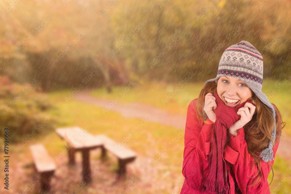 Composite image of cold redhead wearing coat and hat Composite image of cold redhead wearing coat and hat