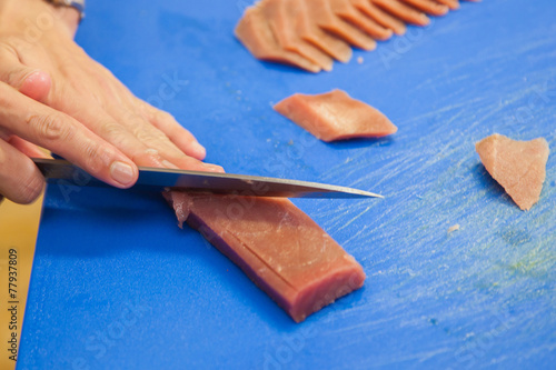 cutting tuna steak photo