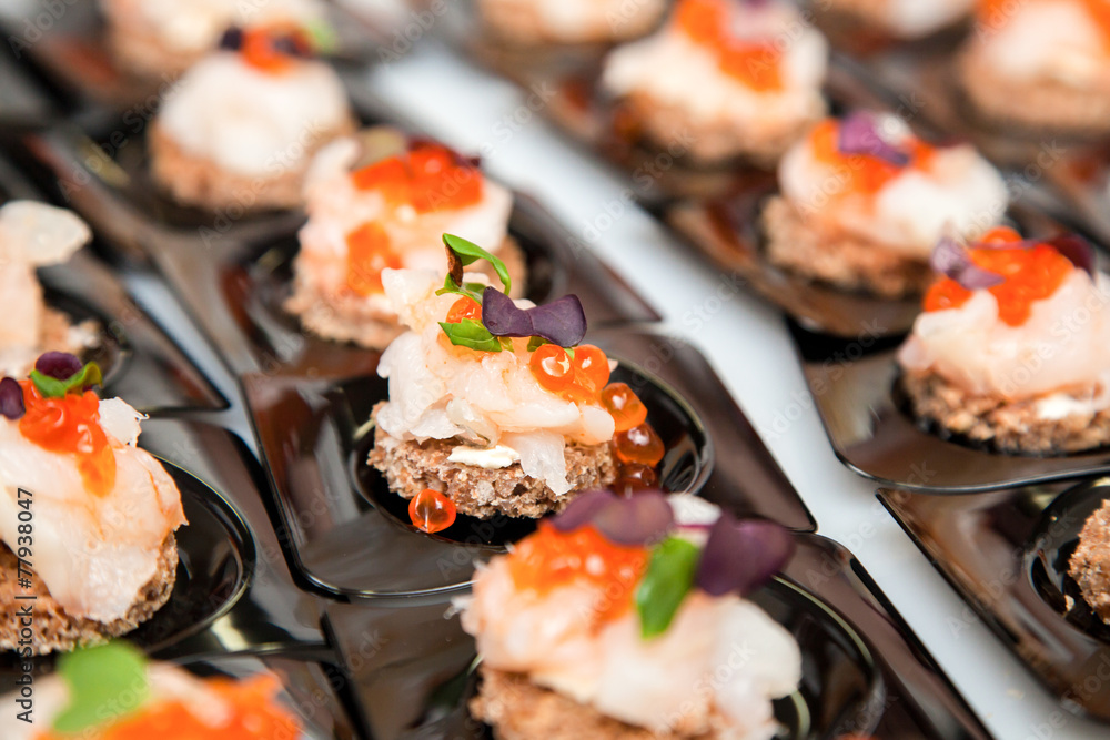 Salmon eggs, fish, and herbs canapes Salmon eggs, fish, and herbs canapes