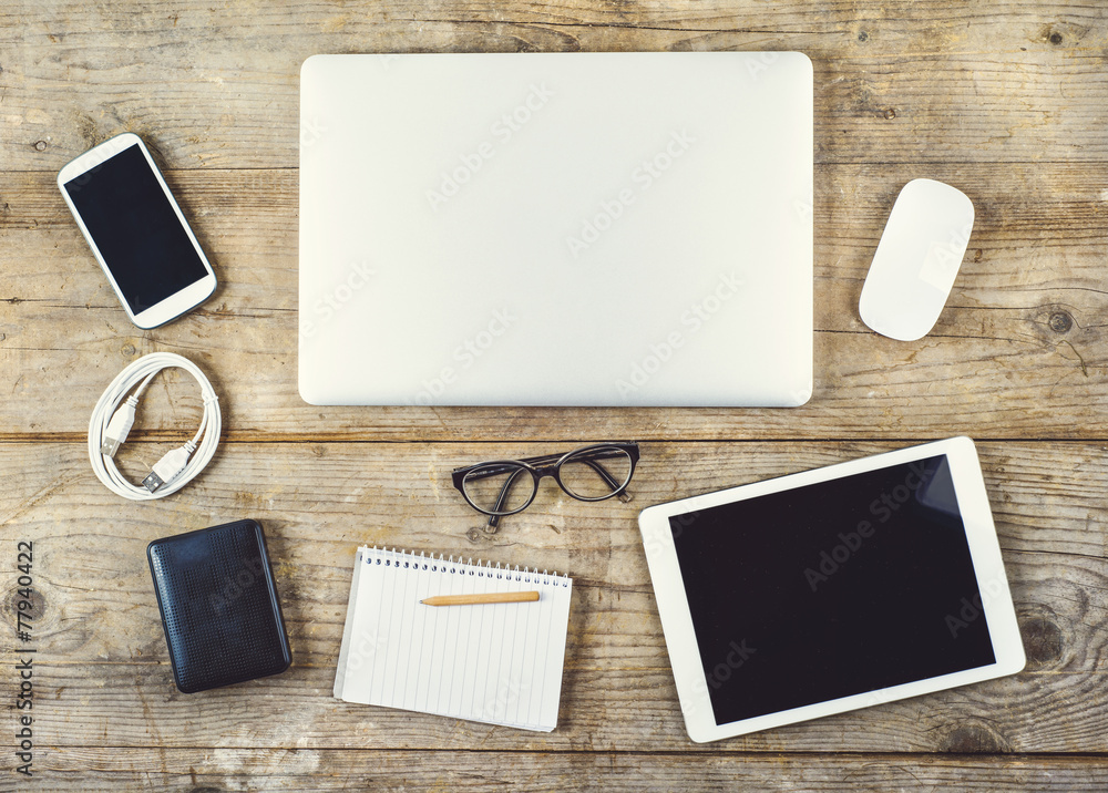 Desktop mix on a wooden office table. Desktop mix on a wooden office table.