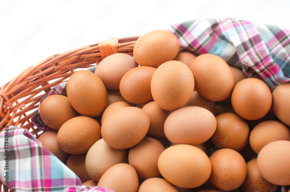 Chicken brown eggs in wicker basket Chicken brown eggs in wicker basket