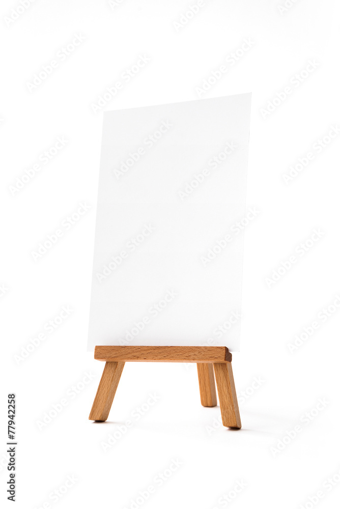 Small easel with white vertical sheet of paper Small easel with white vertical sheet of paper