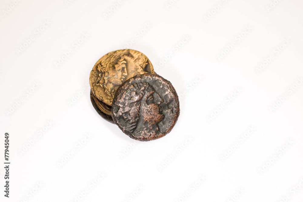 Four old bronze coins on white background Four old bronze coins on white background