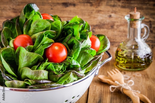 lunch time: fresh green organic lettuce with cherry tomatoes