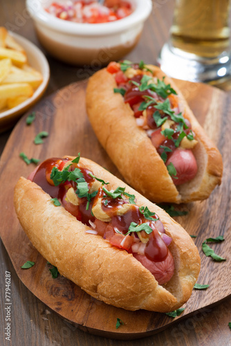 hot dogs with tomato salsa and onions, vertical
