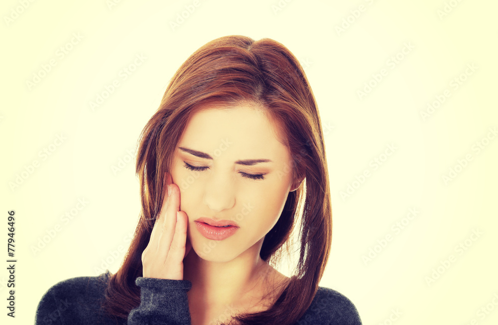 Teen woman having a terrible tooth ache. Teen woman having a terrible tooth ache.