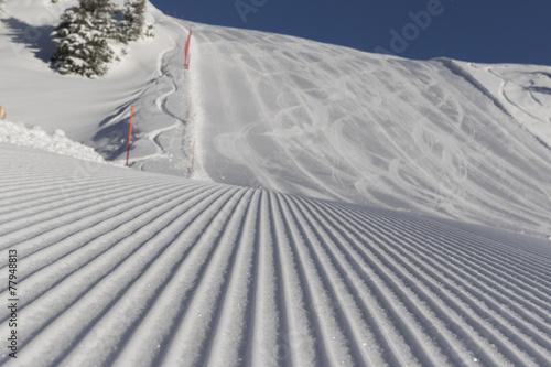 Skiing background - fresh snow on ski slope