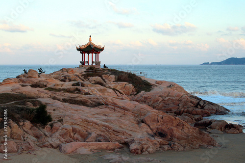 Chinese pavilion on the beach of Putuoshan island, China