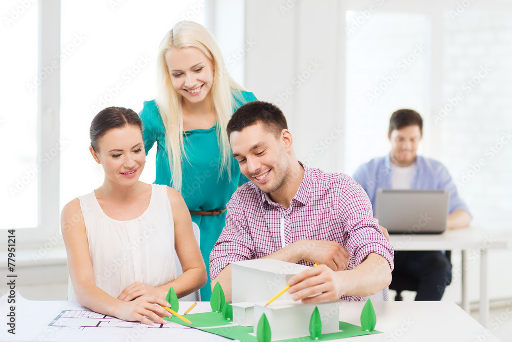 smiling architects working in office smiling architects working in office