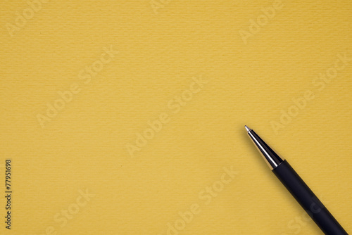 Black ball pen on the yellow papper background