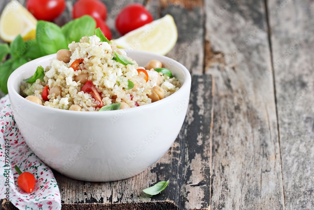 Quinoa salad with vegetables,chickpea and feta.Selective focus. Quinoa salad with vegetables,chickpea and feta.Selective focus.