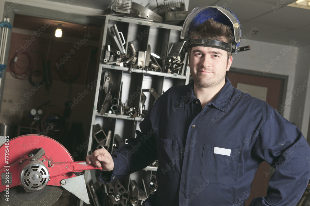 Worker with protective mask welding metal Worker with protective mask welding metal