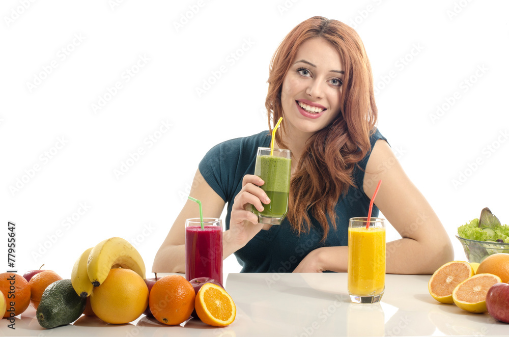 Happy woman having a table full of organic food,juices, smoothie Happy woman having a table full of organic food,juices, smoothie
