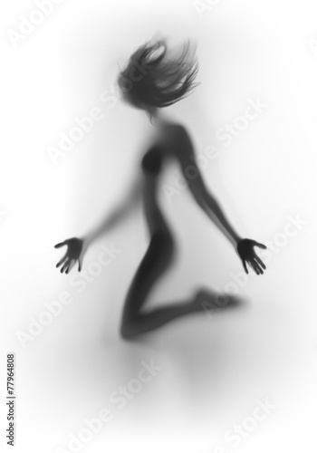 Beautiful and sexy woman body silhouette with blowing hair