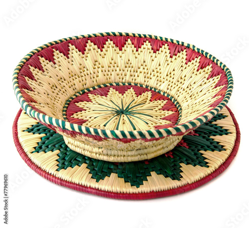 Bild auf Leinwand wicker basket on mat isolated