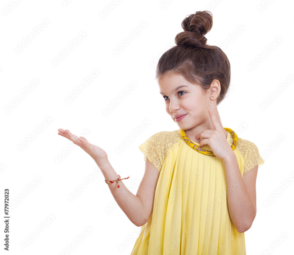 Beautiful youth little girl presenting copy space Beautiful youth little girl presenting copy space