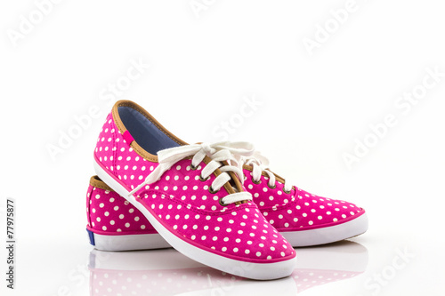 Pink polka dot canvas shoe.