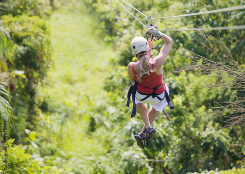 Woman going on a jungle zipline adventure