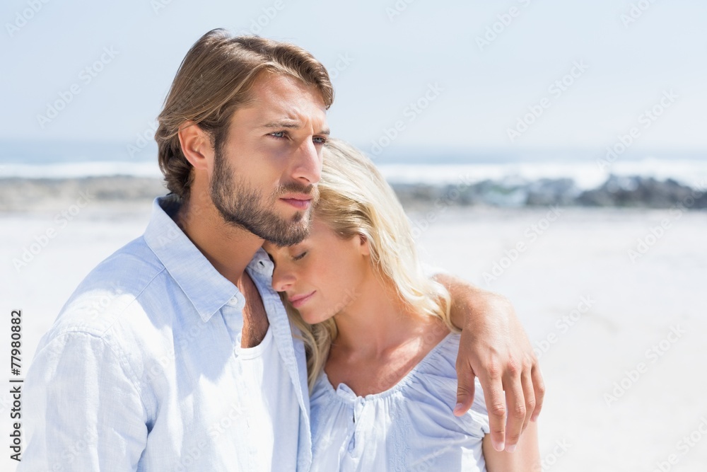Cute couple hugging on the beach
