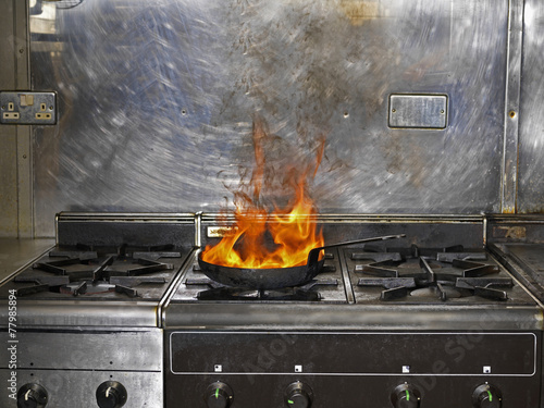 Frying Pan on Fire in Restaurant Kitchen