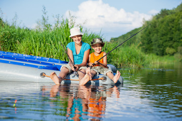 Kids fishing at the river