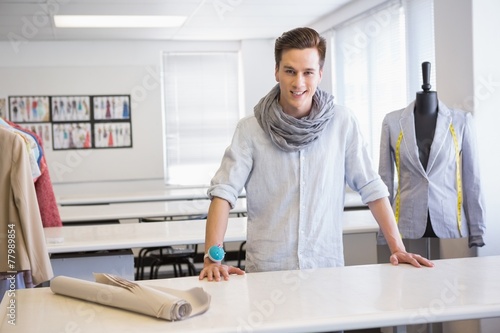 Smiling student posing in classroom