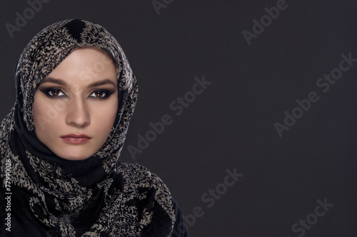 portrait of young beautiful muslim woman with head scarf