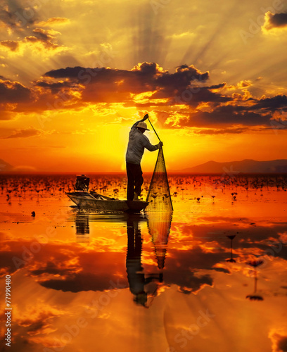 Fisherman of Lake in action when fishing, Thailand