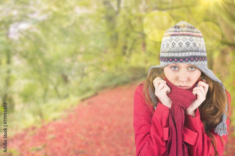 Composite image of cold redhead wearing coat and hat Composite image of cold redhead wearing coat and hat