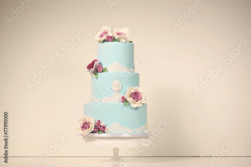 blue wedding cake with roses