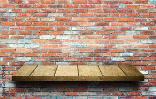 Wood shelf on brick wall background