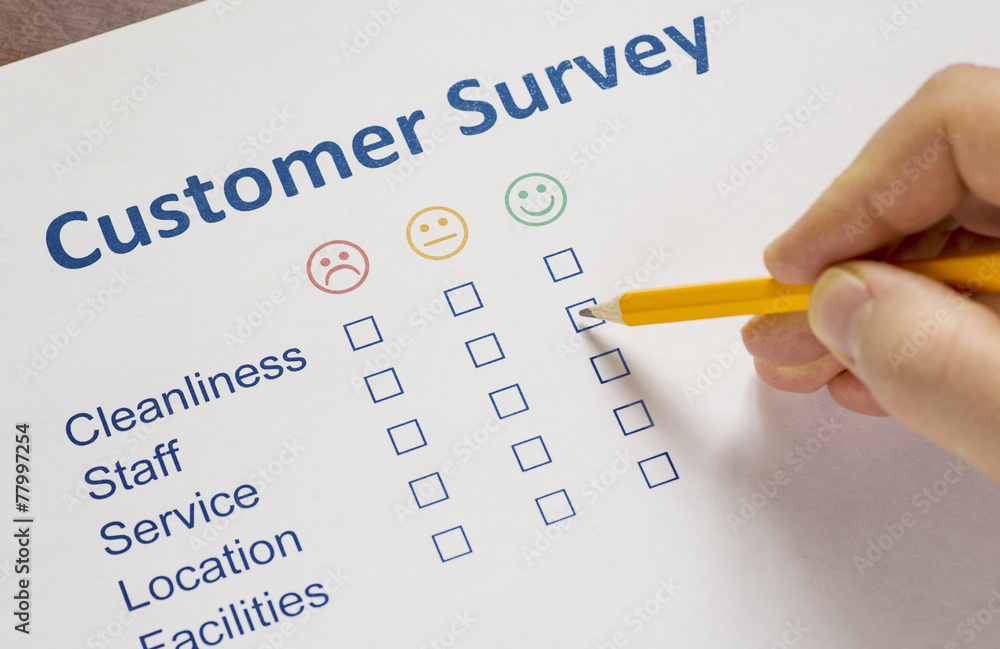 Man completing a customer survey Man completing a customer survey