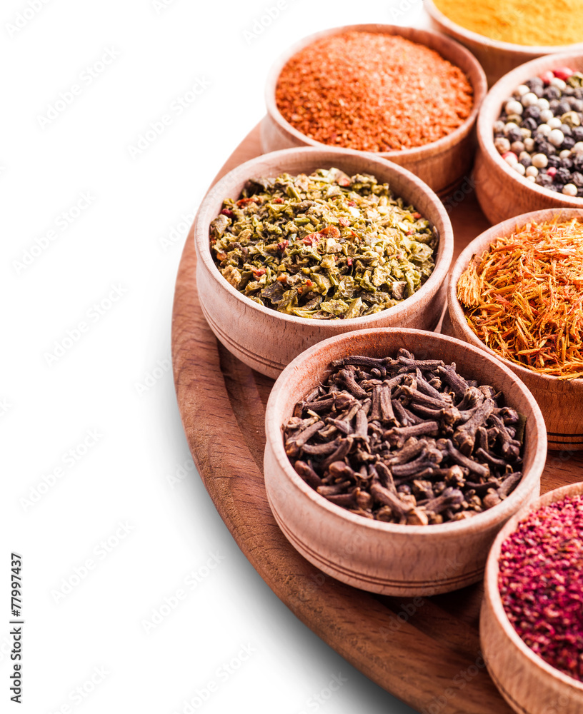 assorted spices in a wooden bowl close-up