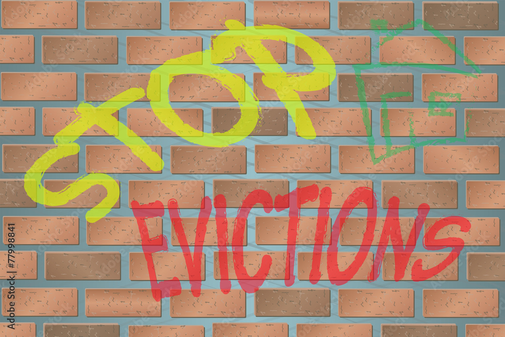 Obraz premium Wall with Graffiti Stop Evictions