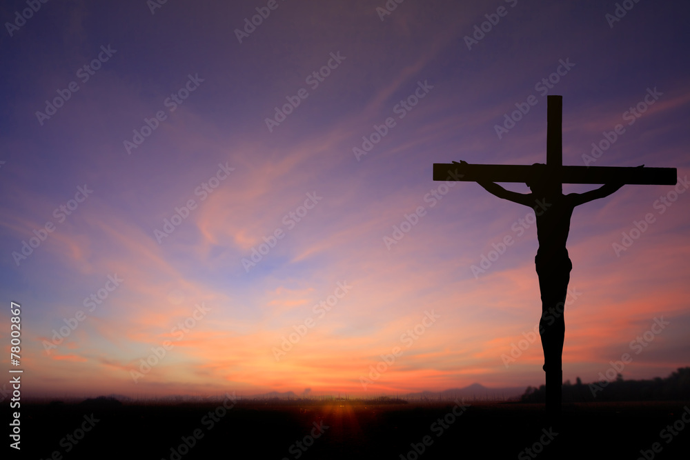 Fototapeta premium Dark Silhouette of Jesus with Cross over rainbow sunset concept for religion, worship, Christmas, Good Friday, Easter, Jesus he is risen, Thanksgiving prayer and praise, promise