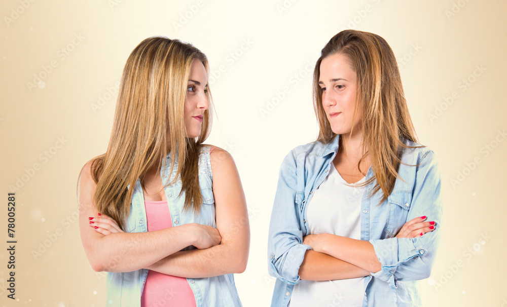 Friends with arms crossed over white background