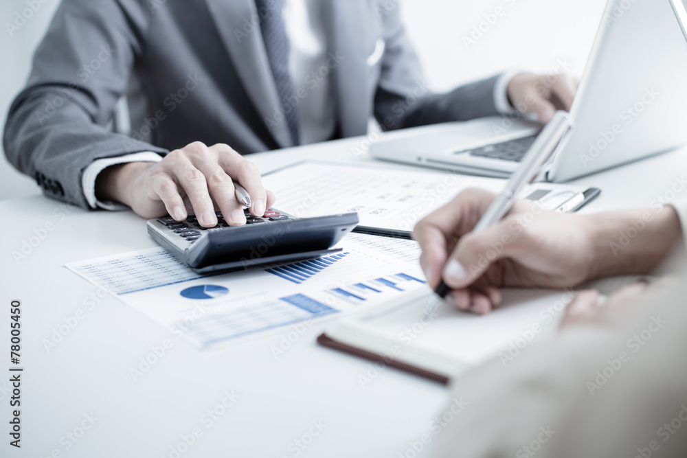 Business people discussing the charts and graphs showing the res Business people discussing the charts and graphs showing the res
