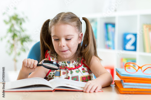 Astonished kid looking thro...